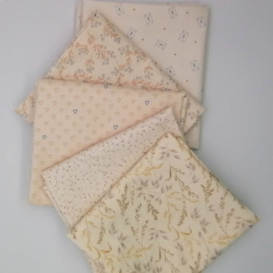 Fat Quarter Bundle LBQ21 - 5 fat quarters fanned showing cream botanical grasses, blush grid texture, blush hearts, blush ditsy floral branch, and cream letter envelope prints from Laundry Basket Quilts