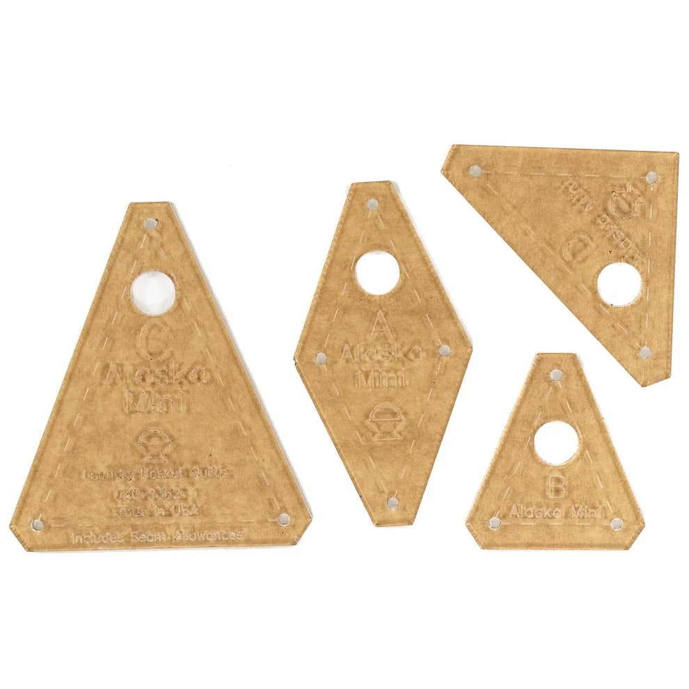 Four acrylic templates in different sizes for the mini alska quilt with pre-drilled holes for accurate piecing.
