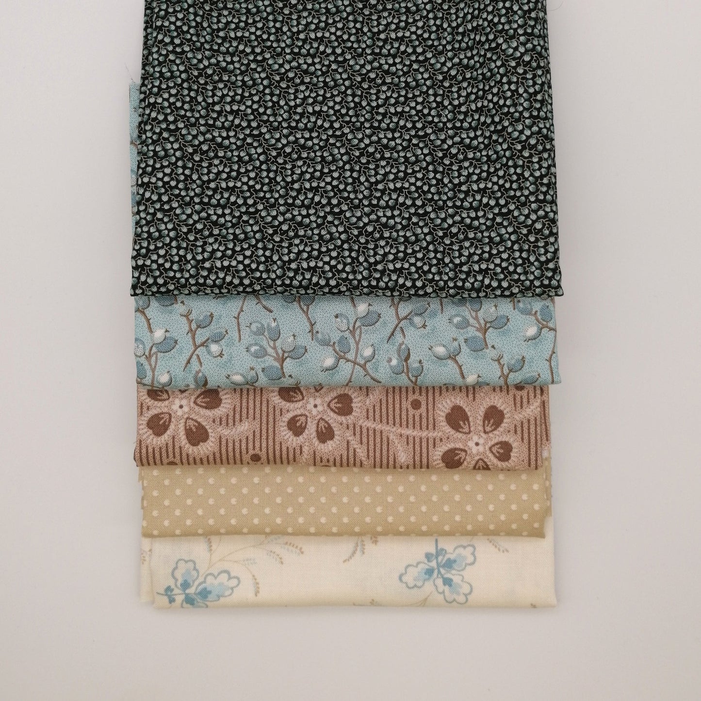Fat Quarter Bundle LBQ16 - neatly folded fat quarters stacked showing full fabric detail