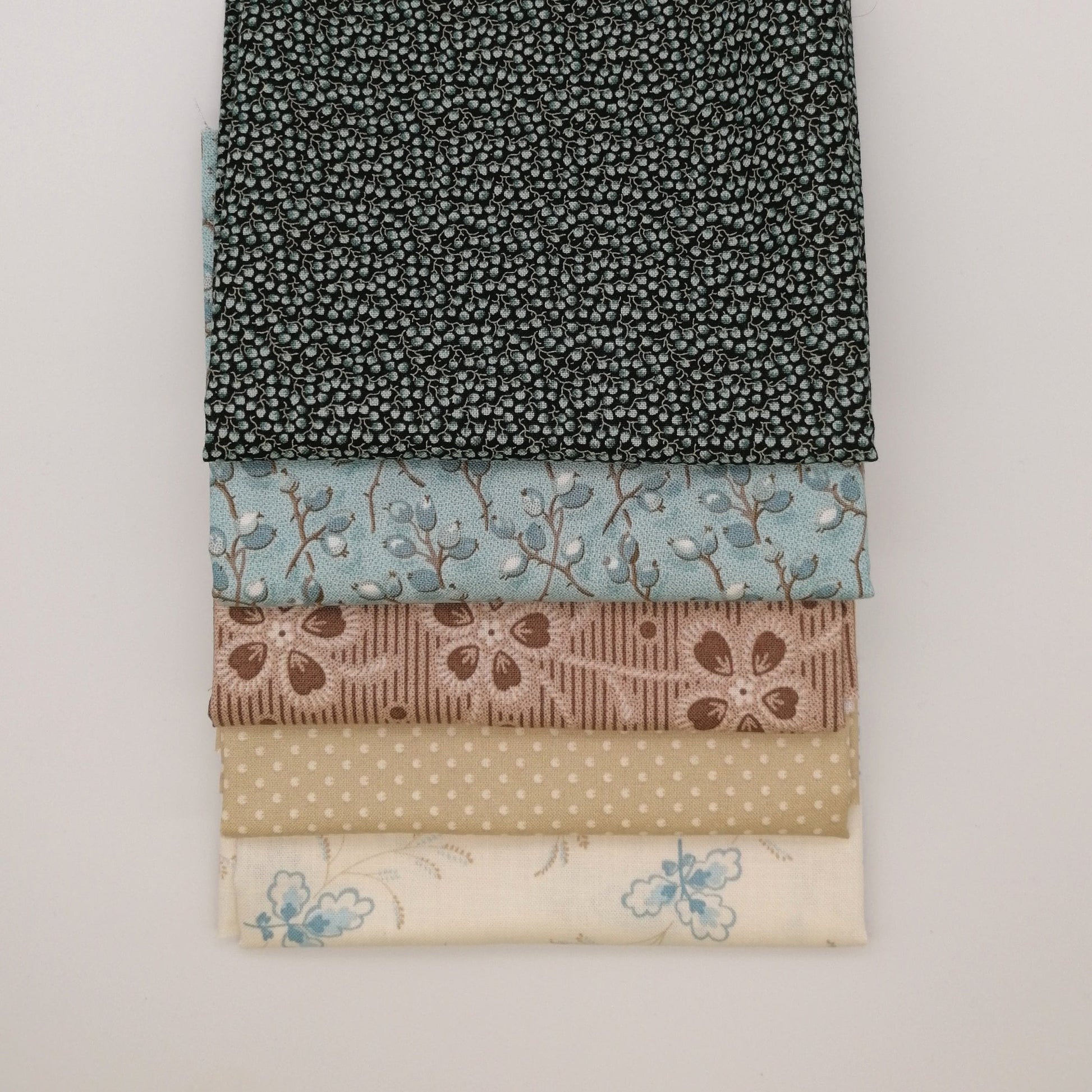 Fat Quarter Bundle LBQ16 - neatly folded fat quarters stacked showing full fabric detail