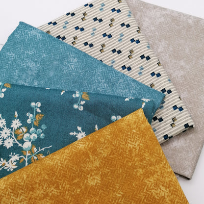 Fat Quarter Bundle LBQ17 - 5 fat quarters stacked showing warm grey, cream stripe with navy squares, teal solid, teal floral, and mustard gold from Laundry Basket Quilts