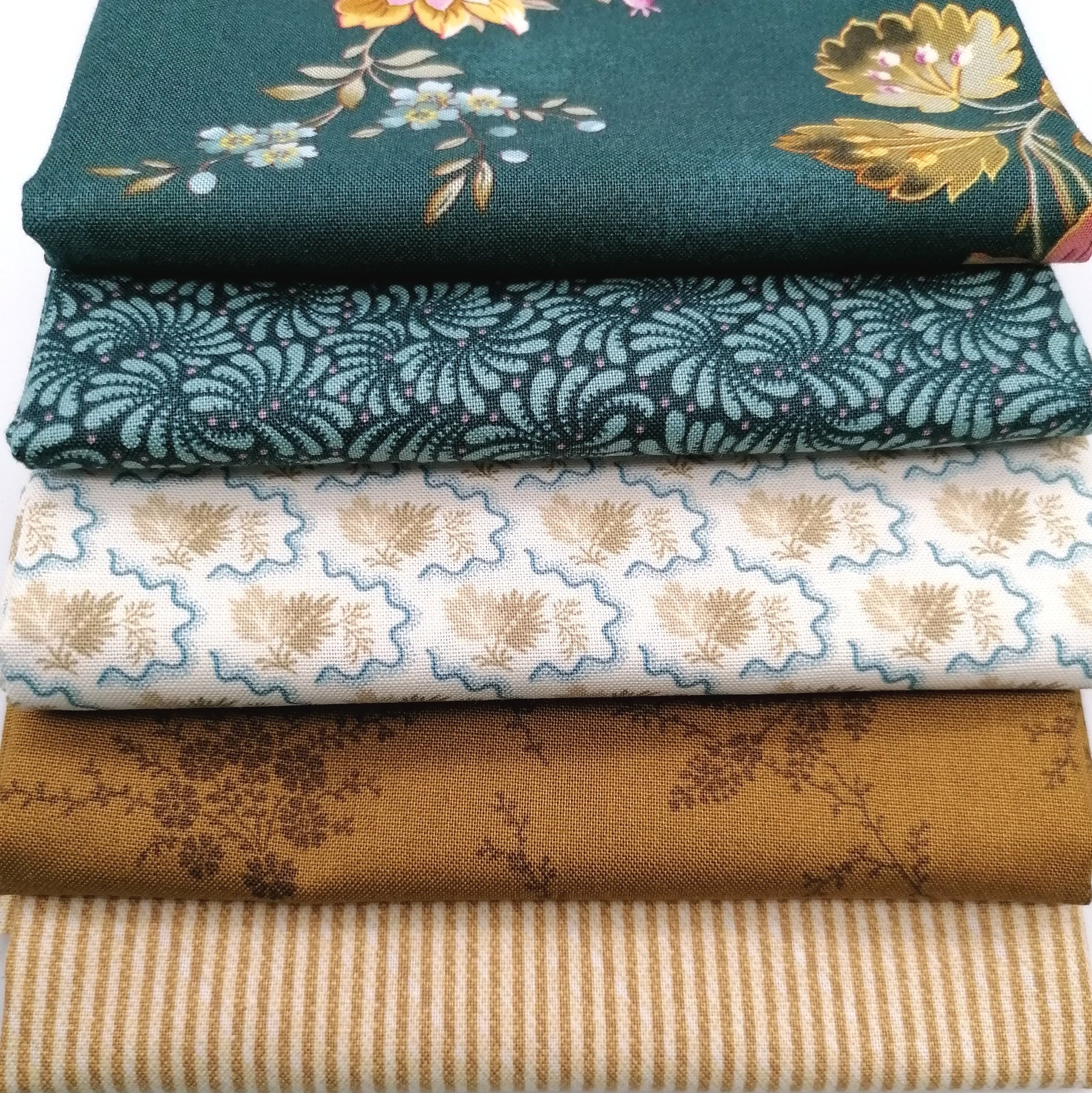 Fat Quarter Bundle LBQ18 - close up detail of forest green floral, teal paisley, cream botanical and mustard gold fat quarters