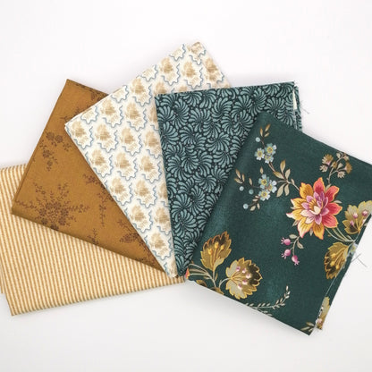 Fat Quarter Bundle LBQ18 - fanned flat lay showing forest green floral, dark teal, cream, mustard gold and honey stripe fat quarters from Laundry Basket Quilts for Andover Fabrics