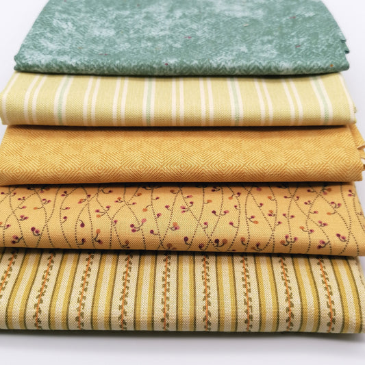 Fat Quarter Bundle LBQ20 - 5 fat quarters stacked showing sage mottled tonal, soft yellow cream stripe, mustard gold diamond geometric, golden sand burgundy floral vine, and cream gold multi-stripe from Laundry Basket Quilts