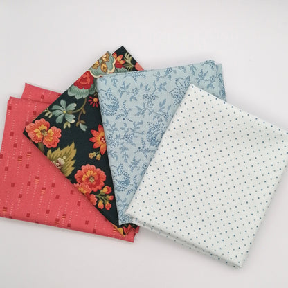 Fat Quarter Bundle LBQ23 - stacked flat lay showing white pin dot, ice blue floral vine, navy peony floral and coral texture fat quarters from Laundry Basket Quilts for Andover Fabrics
