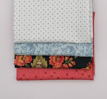 Fat Quarter Bundle LBQ23 - 4 fat quarters fanned showing white grey pin dot, ice blue ditsy floral vine, dark navy coral peony floral, and coral salmon texture from Laundry Basket Quilts