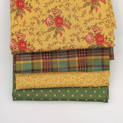 Fat Quarter Bundle LBQ24 - stacked flat lay showing golden floral vine, mustard teal tartan, sand tonal and sage green polka dot fat quarters from Laundry Basket Quilts for Andover Fabrics