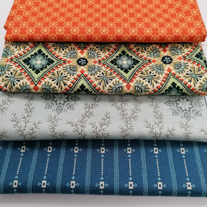 Fat Quarter Bundle LBQ25 - close up stack showing all 4 fat quarters including orange geometric circle print, cream tan medallion with teal green accents, pale grey ditsy floral vine, and dark navy stripe with small florals