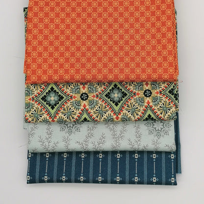 Fat Quarter Bundle LBQ25 - 4 fat quarters fanned showing orange geometric, cream medallion with green and red accents, pale grey floral vine, and navy stripe from Laundry Basket Quilts