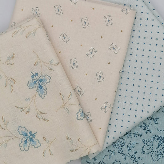 LBQ22 fat quarter bundle featuring Special Delivery and Blue Escape fabrics in cream and light blue