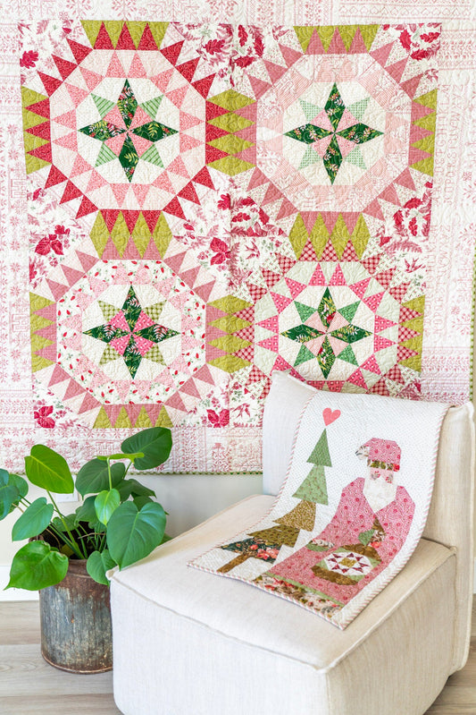 Quilt with a Christmas design on a chair and wall