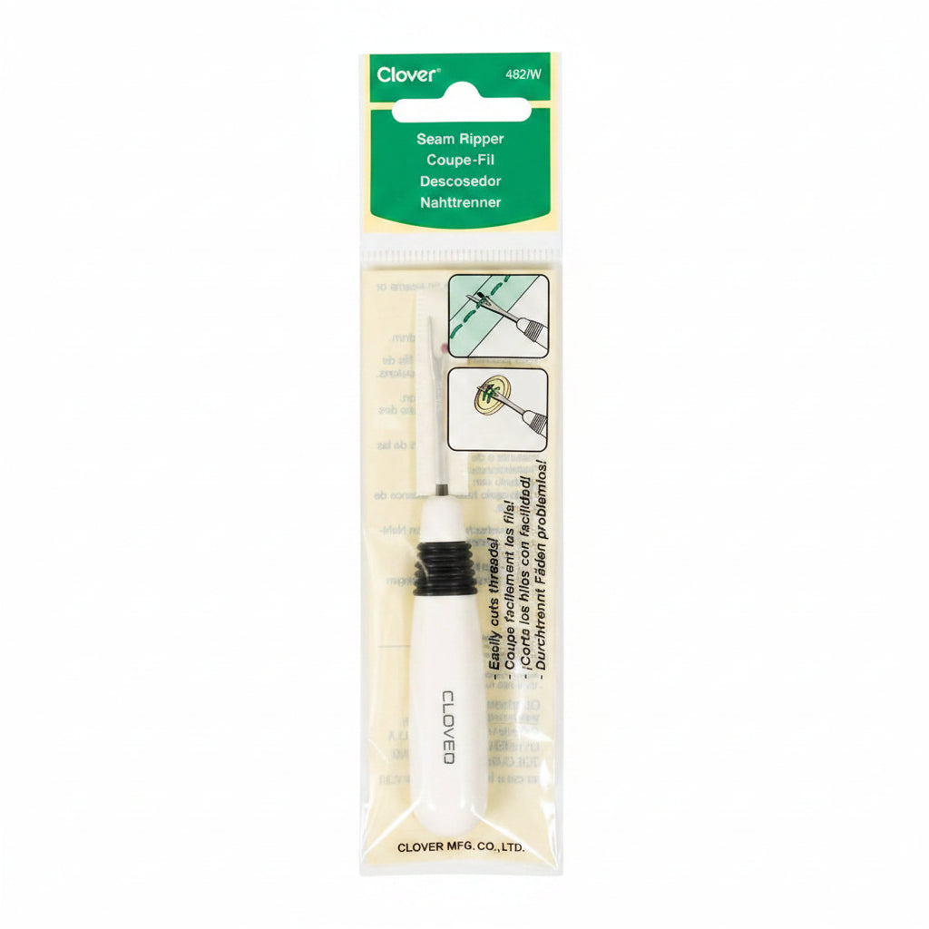 A Clover Seam Ripper Coupe-Fil tool in its original retail packaging, featuring a white and black metal tool inside a clear plastic bag with a green and white header card.