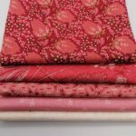 a selection of red and pink fabrics for heart quilts